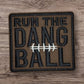 Embroidered brown patch featuring 'RUN THE DANG BALL' text and football graphics.