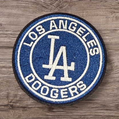 Embroidered Los Angeles Dodgers patch in blue and white, round design, perfect for sports fans.
