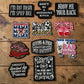 Collection of various patches on a wooden surface