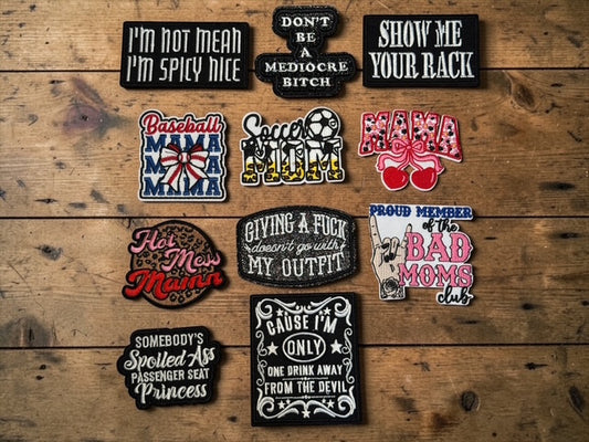 Collection of various patches on a wooden surface